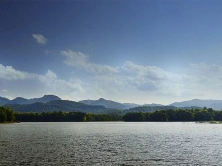 Scenic lake view with hills and forest landscape in Satpura National Park