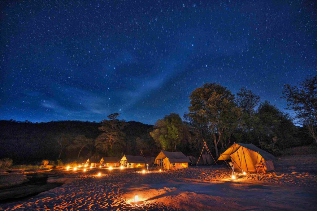 Tents with night sky in Satpura National Park by Denwa Backwater Escapes